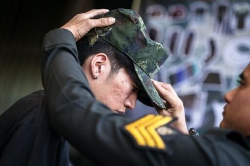 Red or black: Thai men tempt fate at military draft draw | National ...