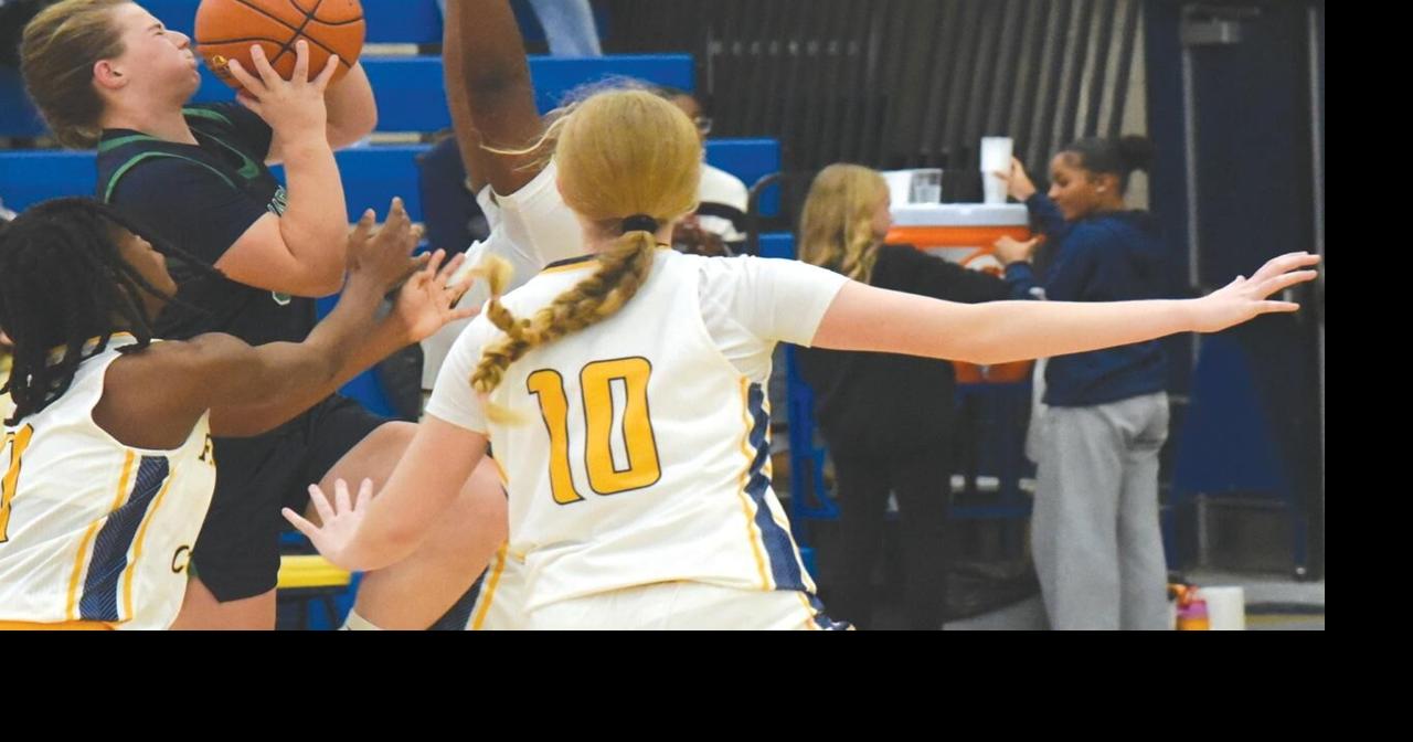 Girls' basketball: Flyers foil Hawks, escape with 95th consecutive district win