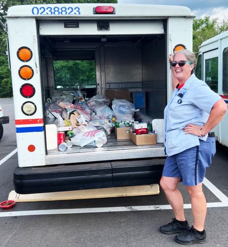 Postal workers give back in food drive