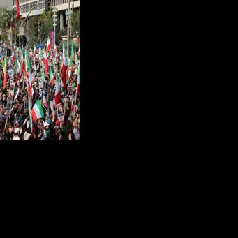 Protesters held flags and placards during a rally in solidarity with protesters in Iran in Los Angeles