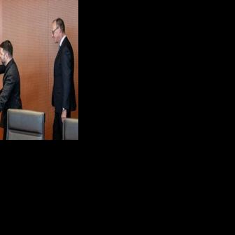 Ukraine's President Volodymyr Zelensky shook hands with US special envoy Steve Witkoff as German Chancellor Friedrich Merz looked on