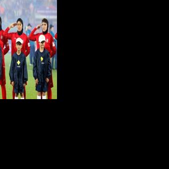 Iran's players salute during the national anthem before the AFC Women's Asian Cup Australia 2026 football match between Iran and Philippines in Gold Coast on March 8, 2026