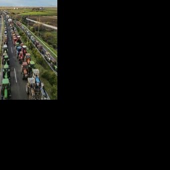 Farmers block the highway outside the city of Karditsa on December 8 to demand swifter access to EU subsidies
