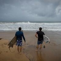 Surfers in Luquillo, Puerto Rico survey conditions with Hurricane Erin approaching, the first of what is expected to be a particularly intense Atlantic season