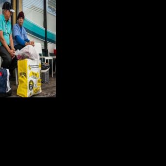 People line up with packages and items to send to Cuba at a Cubamax store in Florida