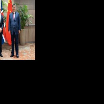 UK Prime Minister Keir Starmer and China's President Xi Jinping at a 2024 meeting at a G20 summit in Rio de Janeiro