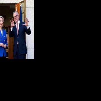 Australian Prime Minister Anthony Albanese (R) welcomes European Commission President Ursula von der Leyen for talks at Parliament House in Canberra on March 24, 2026
