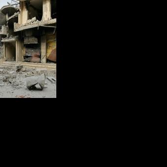 A resident observes destruction in a southern Lebanese border village that had been targeted by Israeli strikes