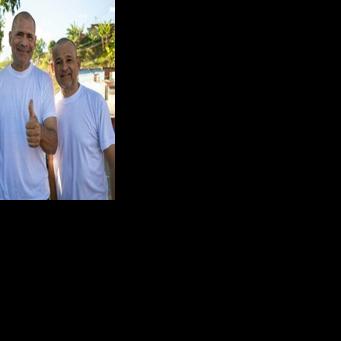 (L to R) Venezuelans Armando Fusil, Richard Corona and Robin Colina pose for a picture after being released from Rodeo I prison on Sunday