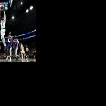 Boston's Jaylen Brown throws down a dunk in the Celtics' victory over the Philadelphia 76ers in their NBA playoff opener