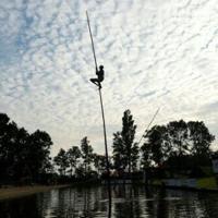 Dutch canal-leaping pole vaulters aim for the sky