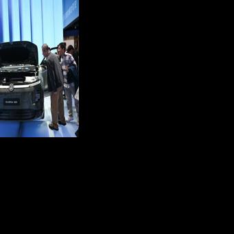 Volkswagen warns of more cost cuts as profits plunge