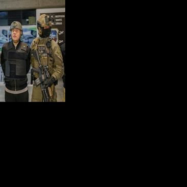 Andres Felipe Marin Silva, aka "Pipe Tulua," is escorted before being extradited to the US in Bogota