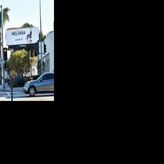 A billboard advertising the film “Melania” was vandalized