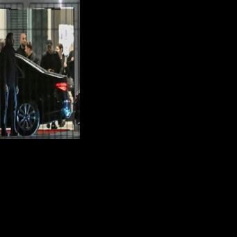 Ukrainian President Volodymyr Zelensky gets into a car after more than five hours of talks at the chancellery in Berlin