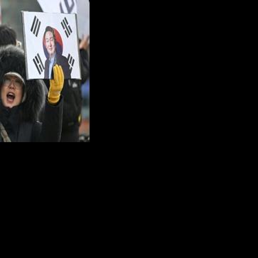 A supporter of South Korea's former president Yoon Suk Yeol in front of the Seoul Central District Court earlier this year.