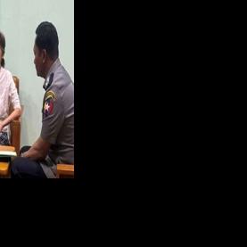 This undated handout photo from the Myanmar Military Information Team released on April 30, 2026 shows Aung San Suu Kyi (C) talking in an undisclosed location