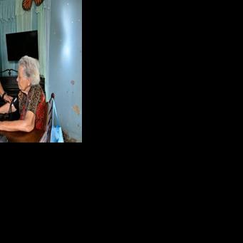 A Cuban doctor provides medical care to an elderly woman at the Nazareth Baptist Church in Havana severe economic crisis