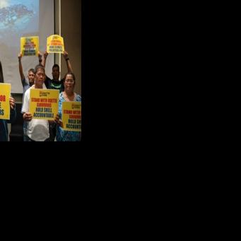 Trixy Elle (centre, L), and other survivors of super Typhoon Rai on Thursday called on British oil giant Shell to provide financial compensation for climate-related devastation