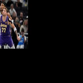 Luka Doncic of the Los Angeles Lakers defends Giannis Antetokounmpo in the Lakers' NBA victory over the Milwaukee Bucks