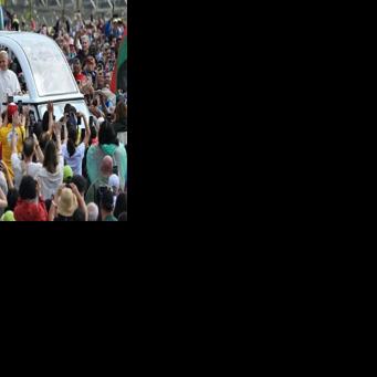 Pope Leo XIV waves to the crowd as he arrives to lead the weekly general audience at St. Peter's square in the Vatican
