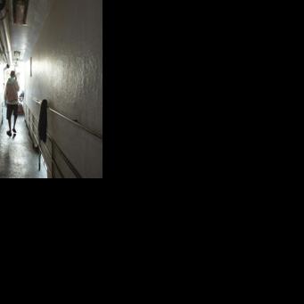 Indonesian national Surono, a crew member of the tuna longliner fishing vessel Novo Ruivo, walks in a passageway at the Porto Grande port in Mindelo