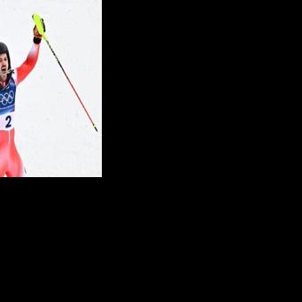 Newly crowned slalom champion Loic Meillard celebrates another Swiss men's ski gold at the Winter Olympics