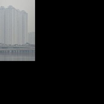 Vehicles drive on a highway during heavy air pollution in Hanoi on December 11, 2025