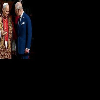 Pope Leo XIV shakes hands with Britain's King Charles III and Queen Camilla in San Damaso courtyard during their state visit to the Vatican