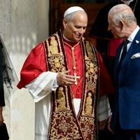 Pope Leo XIV shakes hands with Britain's King Charles III and Queen Camilla in San Damaso courtyard during their state visit to the Vatican