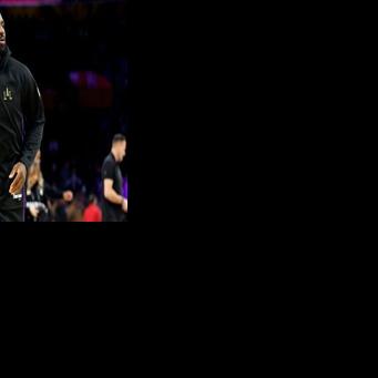 LeBron James of the Los Angeles Lakers, who missed his team's first 14 games of the season, warmed up before starting against Utah to make his debut in an NBA record 23rd campaign