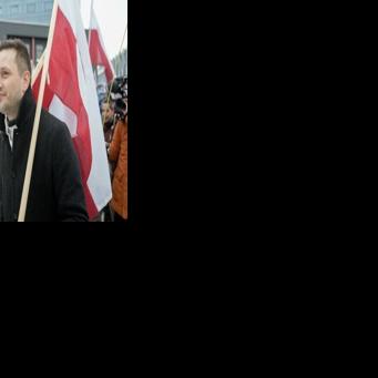 Greenland's leader Jens-Frederik Nielsen held a Greenlandic flag at a demonstration at the US consulate in Nuuk