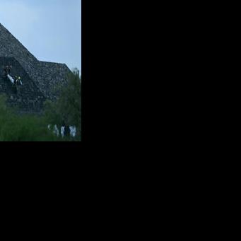 Authorites transport the body of a Canadian woman who was killed by a gunman down the steps of the Pyramid of the Moon following a shooting in Teotihuacan