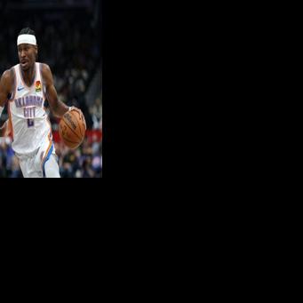 Shai Gilgeous-Alexander dribbles past Sharife Cooper on his way to 40 points in Oklahoma City's stormy win over Washington