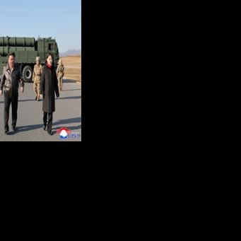 This picture taken on January 27, 2026 and released by North Korea's official Korean Central News Agency (KCNA) on January 28, 2026 shows North Korean leader Kim Jong Un (C) and his daughter Kim Ju Ae (R) inspecting a test firing of the renewed…
