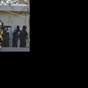 Soldiers take position outside the maximum-security prison in Escuintla, Guatemala