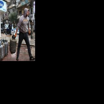 Syria's government was in full control of the two Kurdish-majority areas of Aleppo by Sunday morning