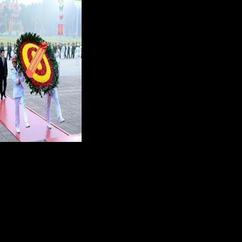 A handout photograph released by the 14th National Congress via the Vietnam News Agency shows paying their respects at the Ho Chi Minh mausoleum in Hanoi