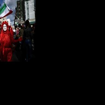 Members of the 'Red Rebel Brigade', a climate activist group, joined the march