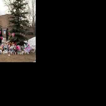 People brought flowers and paid their respects at a community vigil two days after the rural community experienced one of Canada's deadliest shootings