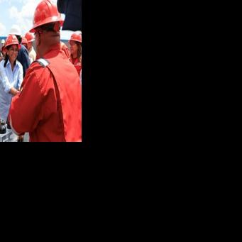 Venezeula's interim president Delcy Rodriguez greets a worker from the state oil company PDVSA next to US Secretary of Energy Chris Wright (2nd L) during a visit to the Orinoco Oil Belt in southern Venezuela