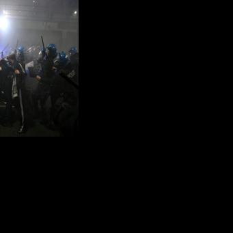 People clash with police during a protest against the environmental, economic and social impact of the Milano-Cortina 2026 Winter Olympics Games, in Milan on February 7, 2026.