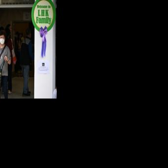 Residents exit a polling station in Tai Po district during the Legislative Council elections in Hong Kong on December 7, 2025.