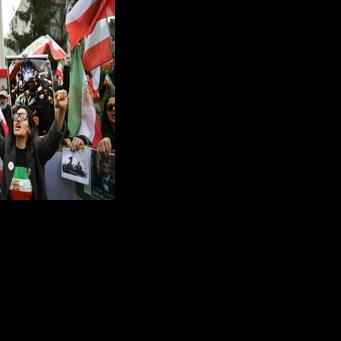 Protesters held flags of Iran from before the 1979 Islamic revolution as they demonstrated against the Iranian authorities in Turkey