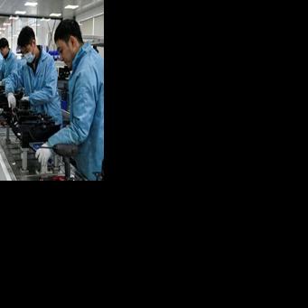 At the autonomous vehicle workshop, managers say humans are still a crucial part of even technologically advanced manufacturing