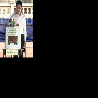 Pheu Thai Party's prime ministerial candidate Yodchanan Wongsawat casts his ballot in Thailand's general election at a polling station in Bangkok