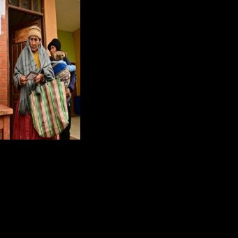 An Aymara woman prepares to cast her vote during the presidential runoff election, in Laja, some 30 km west of La Paz, on October 19, 2025
