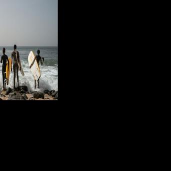 In Dakar fishing village, surfing entices girls back to school