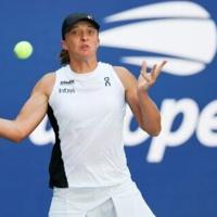 Poland's Iga Swiatek returns during her first round defeat of Colombia's Emiliana Arango at the US Open