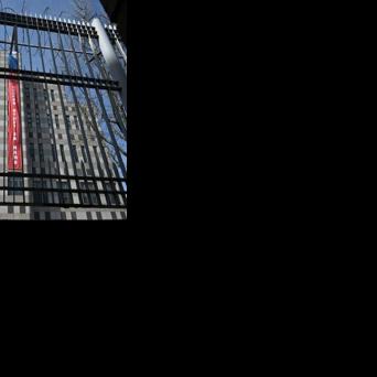 A banner reading "Victory will be ours" is displayed on the exterior wall of the Russian embassy in Seoul